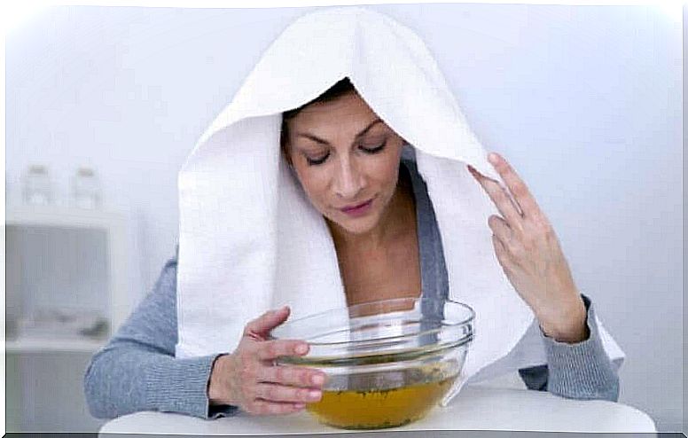 Woman with white towel on her head for steaming