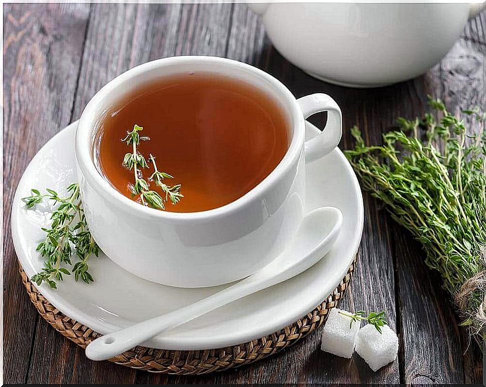 White cup with a thyme tea