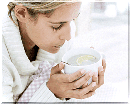 A woman drinking a cup of tea