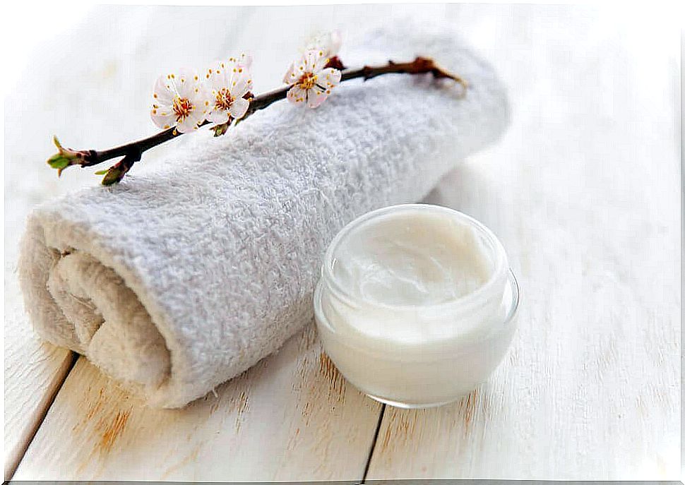 Jar of soap next to towel