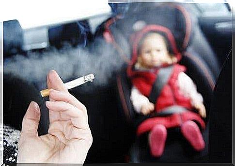 Baby in a car with someone who smokes