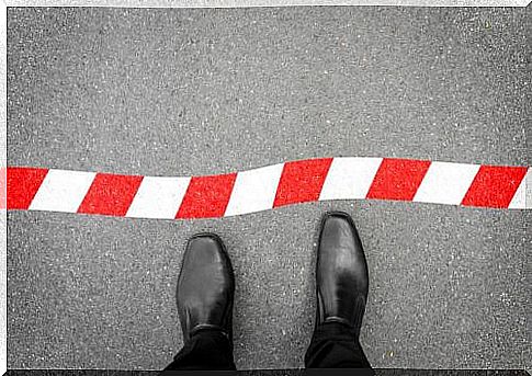 Man Standing In Front Of A Border 