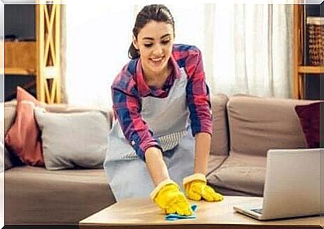 A woman cleans her house