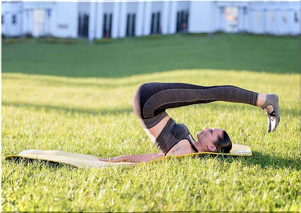 Woman doing rolling back exercise