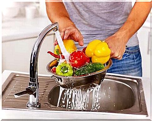 Man washes his vegetables