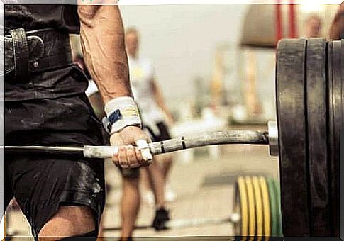 A man lifts a heavy weight at CrossFit