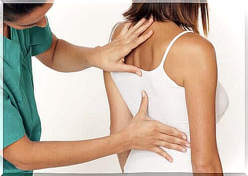 A woman is examined by a doctor