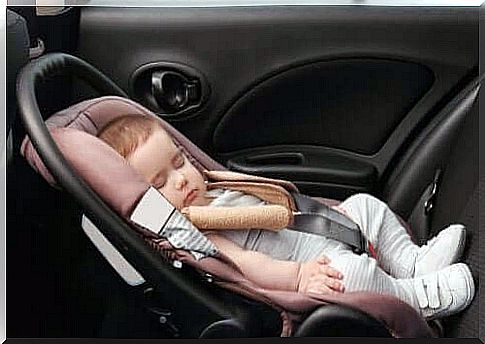 Traveling long distances: a baby sleeping in a car seat