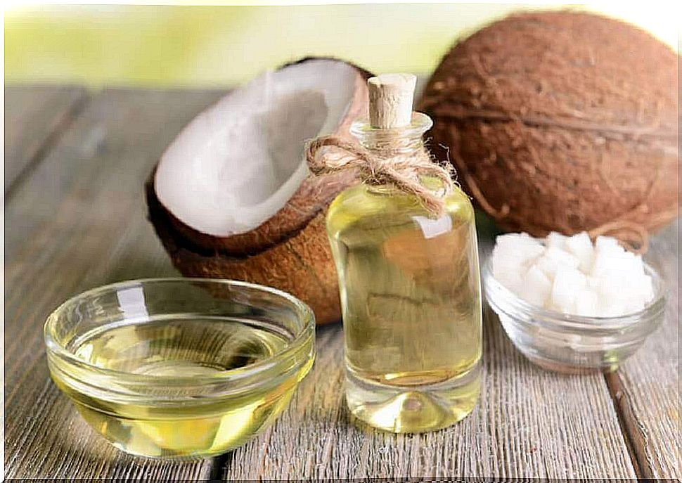 Coconut and bottle of coconut oil