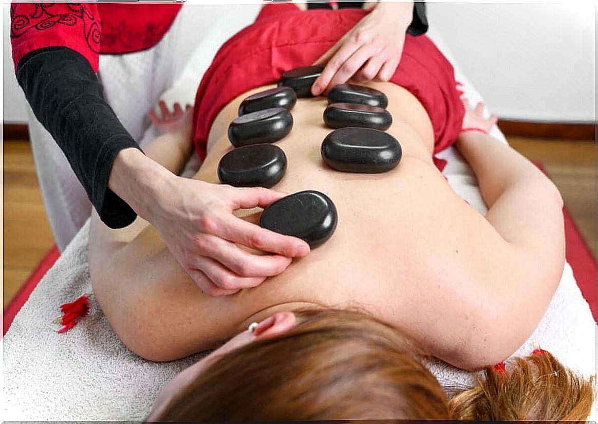 Wife gets a hot stone massage